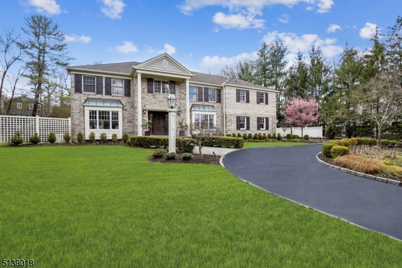 This elegant custom home in the Hartshorn school district has been thoughtfully rebuilt, remodeled and designed with transitional flare.   Substantial design projects and additions have been tastefully created by highly regarded architects David Rosen as well as Timothy Klesse.  Custom millwork and extensive moldings are found in the generously proportioned rooms which is combined with the beautiful flow, creating a sense of artful coordination that is only found in the highest end homes in Short Hills.  A gourmet chef's kitchen, beautiful en-suite bedrooms and tremendous upgrades make this expansive Colonial a divine place to live.  The patio and grounds will also impress the avid gardener since they were designed by a landscape architect who values beauty and privacy in the great outdoors.  Located on a quiet cul de sac, this home is classy, stylish and welcoming.