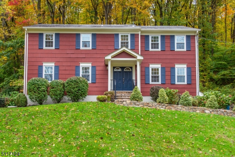 Impeccably maintained and beautifully updated center hall colonial in desirable Valley area. Hardwood flooring throughout, newer kitchen with granite countertops and stainless steel appliances.  Updated powder room, 1st floor laundry and family room with wood burning fireplace, as well as formal living and dining rooms, are some of the first floor features.  Step through sliding glass doors to the recently reconstructed deck with screened gazebo, offering total privacy in the rear yard.  The second floor offers 4 spacious bedrooms, and 2 full baths, including the primary suite with completely updated bath with large stall shower.  Three car garage and utility room complete the basement level.  Newer thermal pane windows throughout, 2 zone boiler is 3 years old.  Incredible location, close to Columbia Trail, Schooleys Mountain Park, WMC High School, Long Valley Middle School and convenience of the small shops in downtown Long Valley. WMCHS offers the IB program.