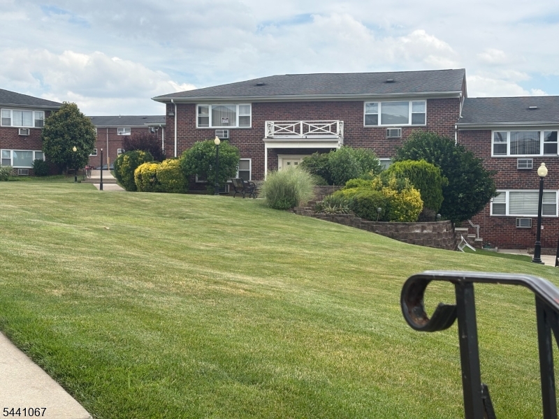 Welcome to this bright and spacious one-bedroom corner unit located on the second floor of a well-maintained brick garden-style complex. As a desirable corner unit, this home is filled with natural light from two large picture windows, creating a cheerful and inviting atmosphere throughout.The unit features a generously sized living room, a spacious bedroom, a functional galley kitchen, and ample closet space for storage. The thoughtfully designed layout offers comfortable everyday living with an abundance of sunlight.Utilities included : Heat, Hot and Cold water ,Gas. Buyer only pays for ElectricResidents enjoy beautifully landscaped grounds, assigned parking for one vehicle, and convenient on-site laundry facilities located in the lower level of the building. Ideally situated near shopping, houses of worship, restaurants, and major transportation options, including easy access to New York City.A wonderful opportunity to own a bright, comfortable home in a convenient location!