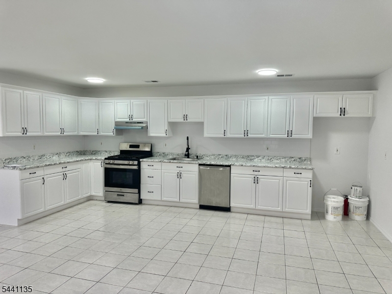 Wow, huge sunny 2nd floor apartment. Completely redone and move in ready. Large 3 bed room and 2 full bath with washer and dryer hookups. All tile floors with a nice balcony overlooking the Avenue. Close to everything a must see!!!!