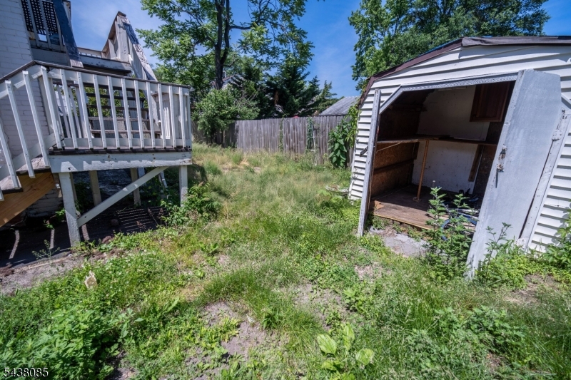Rear two-family in Keansburg offering strong rental upside. Updated kitchen featuring white shaker cabinets and a subway tile backsplash, a refreshed bath with gray tile and a walk-in shower, and fresh paint throughout it is move-in ready. One unit is currently tenant-occupied and features hardwood floors and a functional layout. Roof replaced in 2019. Driveway parking is available. Ideal for investors or owner-occupants seeking rental income. Easy access to the Garden State Parkway, NJ Transit, and the Raritan Bay waterfront.