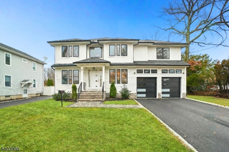 Experience the pinnacle of luxury living in this magnificent newer construction Colonial, offering over 4,700 sq ft of exquisite craftsmanship on 0.23+ acres. Built just two years ago, this home feels brand new and is perfectly situated in a prime Livingston location, moments from the town center, top-rated schools, shopping, dining, and the NYC bus. Step inside to an expansive open floor plan designed for modern entertaining. The heart of the home is the gourmet Chef's kitchen, equipped with high-end appliances, custom cabinetry, and a center island that flows seamlessly into the sun-drenched family room with a cozy fireplace. The first floor also features a dedicated office, a convenient mudroom, and a coveted first-floor suite. Upstairs, retreat to the luxurious primary suite featuring a spa-like bath and massive walk-in closets. This level also includes an additional ensuite bedroom, spacious secondary bedrooms, and a laundry room. The fully finished basement is an entertainer's dream, boasting a recreation room, wet bar, full bath, and a flexible 7th bedroom. With approx. 8 years of builder warranty remaining and low taxes, this home offers incredible value and peace of mind.