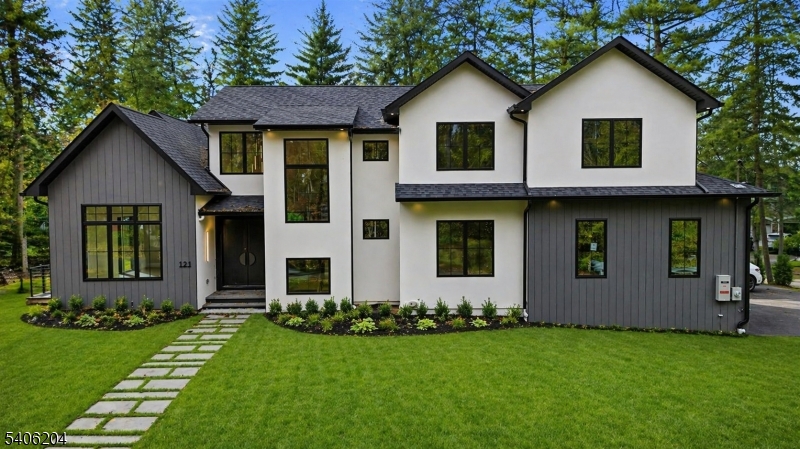 New Price Reintroduced. Luxury takes center stage in this exceptional custom home offering over 6700 sq ft, including an oversized heated 3 car garage, set on 0.35 acres. Dramatic 1.5 story ceilings elevate the dining, living, and family rooms, while oversized windows and refined designer finishes create a bright, sophisticated setting ideal for both everyday living and entertaining. The chefs kitchen anchors the home, featuring custom cabinetry, quartz countertops, professional grade stainless steel appliances, and a large island with seating. The main level also offers a first floor guest suite, mudroom, and powder room. Upstairs, four spacious bedrooms boast 9 foot tray ceilings, including a luxurious primary suite with dual custom walk in closets and a spa inspired bath with soaking tub and double vanity. Additional highlights include oak flooring throughout, radiant heat in all full baths, central vacuum, and extensive custom millwork. The fully finished lower level offers flexible living with a rec room, gym area, ensuite bedroom, glass enclosed wine storage, and pre wired home theater. Complete with a full house generator, multi zone HVAC, full landscaping package, covered porch with gas hookup, and a 10 year home warranty. A rare opportunity to own new construction in a prime location now competitively positioned for todays market.