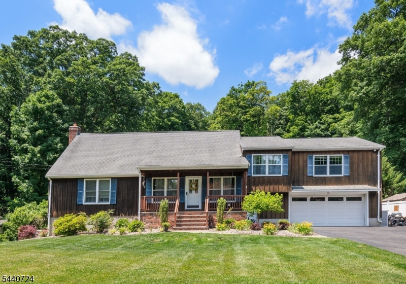 Welcome to 36 Hancock Dr. Custom built in move-in ready condition with rustic charm and up to date amenities.  Enter from the welcoming open porch  into the great room accentuated by wood beams that add character and warmth.  Chef's kitchen with wood cabinetry and center island, stainless appliances and farm sink open to dining area,. Family room offers wrap around window with view of the pool, deck and private property. This level offers bedroom, office  full bath. Upper level has a loft/ library, bedrooms, 2 full baths. There are five bedrooms in total, but please note that the home is currently on a three-bedroom septic system. Finished basement offers recreational room, a bar, gym, ldry, storage, 1/2 bath and access to well manicured back yard. Oversized 2 car garage and parking for many vehicles. Must stop by to view this custom home!