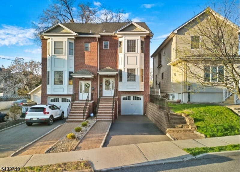 Spacious townhome with a single-family feel. Built in 2009, this 2,497 sq ft residence spans four finished levels with hardwood floors throughout.  A private patio and backyard set the stage for summer gatherings or a peaceful retreat. The main level features a bright, open-concept layout that links the sun-filled living room, dining area, and kitchen ideal for everyday living and entertaining. The kitchen includes stainless steel appliances with a new refrigerator and dishwasher. Additional upgrades include a new washing machine, boiler, a full-house water filtration system with reverse osmosis, energy-efficient LED lighting, and dual-zone heating and cooling. Close to restaurants, shopping, and schools, with easy transit access to NYC.