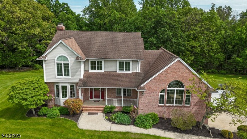 Peace and serenity surround you in this spectacular custom-built Colonial with an extra suite on 4.40 acres backed up to wooded land preservation and lake views nestled in a cul-de-sac. The sunset views help to enhance the elegant lifestyle offered by this unique home. You'll be totally impressed the minute you walk thru the front door into a two-story foyer. Design features start with this impressive Great Room with cathedral ceiling, new vinyl plank flooring accented with skylights and recessed lighting, and sliders leading out to the deck, gourmet kitchen with lots of counter and cabinet space, new granite counter tops, stainless steel appliances, butler and work area, breakfast bar, tile flooring, sliders leading out to an oversized Trex type deck overlooking the pool and backyard.  Formal Living, Dining, and Entertainment Room with wood burning FP, 1st floor laundry. Master bedroom features a vaulted ceiling, 2 closets, master bath with double vanity, soaking tub, stall shower, 3 more impressive size bedrooms all with brand new carpet, and another full bath.  Lower level features a separate entrance, a full bath with steam shower, living/dining room area perfect for a guest suite. Efficient Geo-Thermal Heat and Central Air. For the discriminating purchaser who can appreciate exquisite detailing and design, this home is worlds apart from other homes available in the marketplace.  No other property more adequately describes the phrase, "When only the best will do"