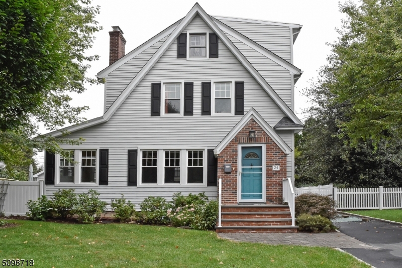 Welcome to 24 Park Way in Morris Plains. This 4 bedroom 2 1/2 bath Colonial home has a blend of old world charm as well as all the modern touches. Hardwood floors throughout. Kitchen w/ granite counter tops, subway tile back-splash and recessed lighting. Formal D/R w/ chair rail and wood molding, L/R with wood burning F/P. Den/ Sun room and 1/2 bath complete the first floor. Second floor has 3 bedrooms and 1 full bath completely updated. Third floor has the Main Bedroom suite w/ full updated bathroom and terrace overlooking the backyard. A large patio and deck complete this home giving you the privacy you need and the time to just sit back and relax. Close to train, 287, Rt 10,80, 24 and 78.