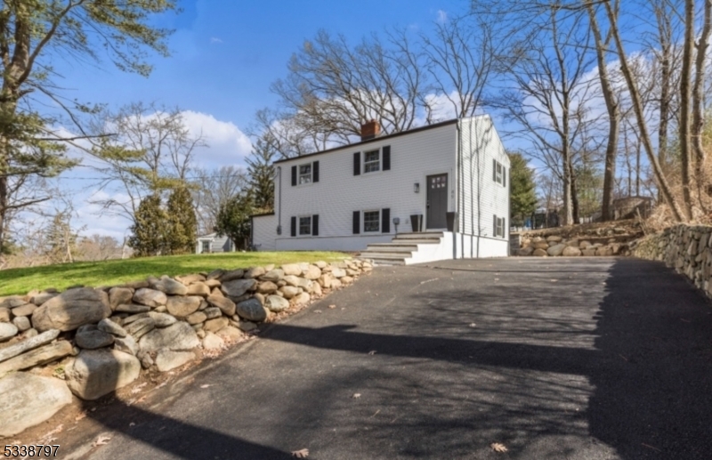 This Newly Renovated modern Colonial home in Sparta New Jersey is just blocks from the iconic Lake Mohawk and 50 miles from NYC, offering a perfect blend of suburban tranquility and city convenience. Enjoy a gourmet kitchen with granite countertops, a 7 burner Thermador Stove, Dishwasher, and a glass-front Samsung Refrigerator. The main floor features a spa-like shower with custom jets, while the Living Room includes an electric Fireplace for a cozy atmosphere. The outdoor space boasts a new paver Patio, Retaining Wall with custom stone steps, and a large Backyard with outdoor Firepit ideal for entertaining. Additional highlights include a new Septic System, Air Conditioning, Roof, Siding, HVAC, Plumbing, Electrical Systems, Natural Gas & Low Taxes! Sparta offers the #1 School District in Sussex County, nearby the famous Lake Mohawk, Top-Rated Dining, Grocery Stores, Shops, Entertainment, Golf Courses & much more!