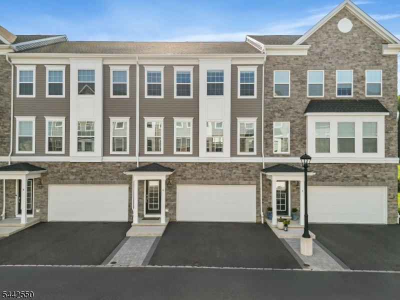 Step into this stunning 2023 built luxury townhome at The Collection at Morris Plains bult by Lennar. This spacious three-level home features 3 bedrooms, 3.5 bathrooms, an open-concept layout, a gourmet kitchen with a large quartz island, shaker style cabinets, stainless steel appliances, and hardwood floors throughout the main living area. Additional highlights include a versatile first-floor recreation room with a full bath, a luxurious primary suite with a spacious closet, second-floor office nook, convenient third-floor laundry, and a two-car garage. Great schools !!!Enjoy scenic walking paths and a peaceful babbling brook, all while being just minutes from the Morristown Train Station, shopping, dining, and major highways for an easy commute to New York City.