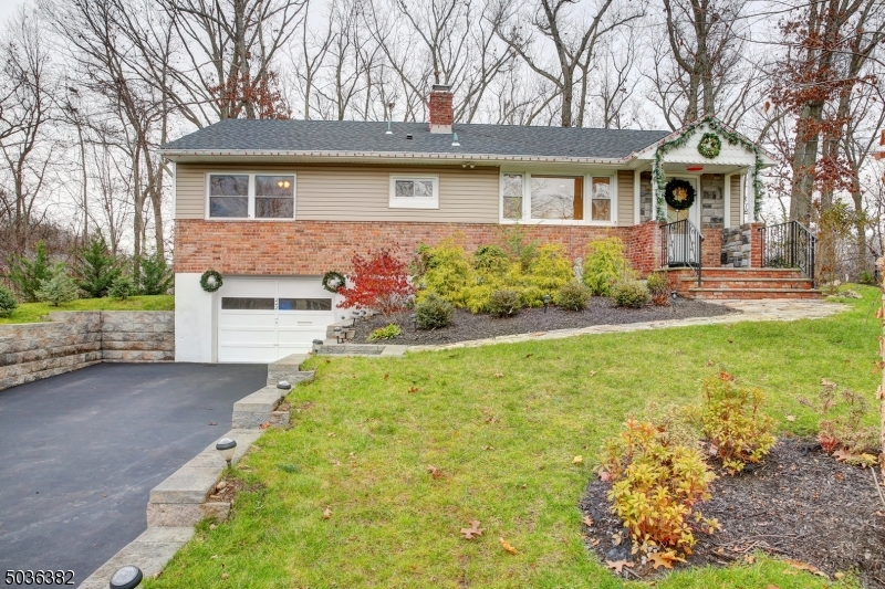 If you want perfection,and newness you have come to the right Place!2/3 Br,2.1 Baths, Newer driveway, steps, siding, windows, new kitchen, with Magma granite and black stainless appliances. Door to deck. Tray ceiling with interior lighting.  Breakfast Bar, counter top with triple glassware cabinet. Dining room or 3rd bedroom, hw/ floors newly refinished, sliding glass doors to patio. Now to the bedrooms, one has half bath, there is a full bath in hallway. The exquisite moldings are custom done!! Crown and wide base moldings. Lower level consists of a full bath, Rec Room and office. There is also a bar area, lots of wide base molding and lighting. Walk into an extra deep garage. Outside you have custom Stone patio and seating, Pergola with floor, custom shed, and fenced vegetable garden. Highest , best Tues