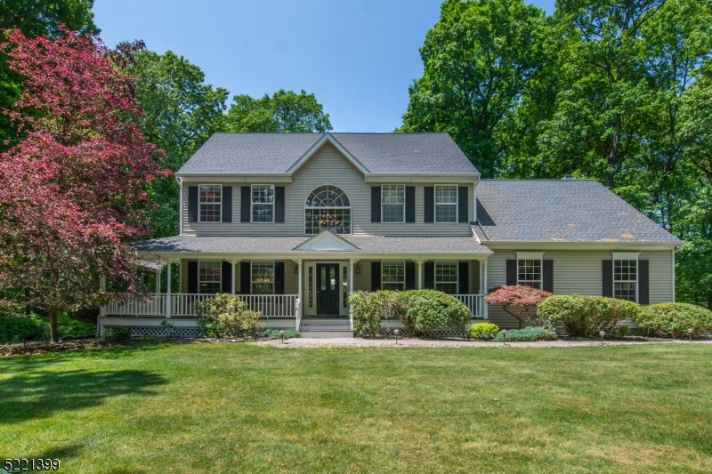 Well maintained younger colonial with in-ground pool and privacy!  Rocking chair wrap-around front porch leads to two story foyer and hardwood flooring throughout the first floor.  Center island cherry eat-in kitchen with granite counter tops and pantry, first floor laundry, formal living and dining rooms with French doors, step-down family room with Jotul wood stove, vaulted ceiling and newer skylights, first floor office and powder room complete the main living space.  Primary suite offers large bedroom with tray ceiling, 2 walk-in closets and sitting room, 3 additional generous sized bedrooms and main bath with tubshower complete the second floor.  Unfinished basement with high ceilings, inground pool wtih waterfall feature surrounded by aluminum fencing, deck overlooking private backyard, new roof, gutters and skylights in 2021, paver walkway, newer AC unit in 2020, furnace in 2018, new hot water heater in 2021, Long Valley schools and West Morris Central High School with IB Program are additional features.