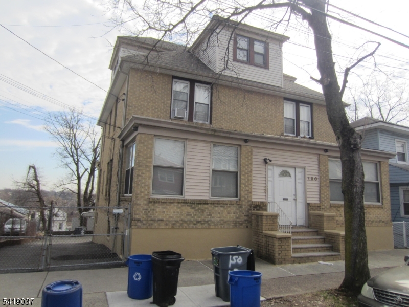 Excellent property features separate heat, finished basement w/full bath, well maintained apartments, 3rd floor updated w/new refrigerator & stove, newer roof, all brick, large 3-car garage, great investment property.