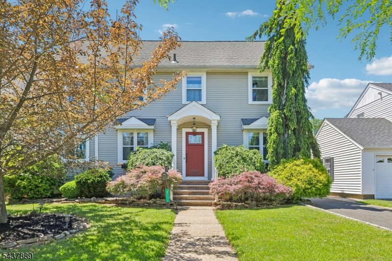 Welcome home to this charming 5-bedroom, 3 full bath Colonial nestled on a picturesque tree-lined street. A quaint entry foyer welcomes you into a spacious living room, offering a warm and inviting atmosphere. Just off the living room, a flexible bonus room provides the perfect space for a home office, den, guest room, or fifth bedroom. Step down into the enormous family room, ideal for entertaining or everyday living, complete with a convenient mudroom and direct access to the backyard. The tastefully updated eat-in kitchen offers both style and functionality, flowing seamlessly into the formal dining room to create the perfect setting for gatherings large and small. The second level features a truly unique oversized primary suite, complete with a large walk-in closet, convenient second-floor laundry, and an updated en-suite bathroom with a stall shower. Three additional generously sized bedrooms and another updated full bath complete this floor. A finished walk-up third floor provides even more living space and is perfect for a playroom, recreation room, home office, or creative studio. The full unfinished basement offers endless potential and awaits your personal touch. Outside, enjoy a cozy patio, a spacious yard, and a detached two-car garage. Combining timeless charm, thoughtful updates, and abundant living space, this exceptional home is ready for its next chapter.