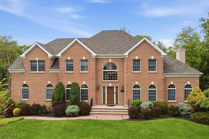 Move-in ready & meticulously maintained, this custom-built brick-front Center Hall Colonial set on a beautifully landscaped 0.34-acre lot on a sought-after cul-de-sac in Livingston.Featuring 5 bedrooms, 3.5 bathrooms & quality finishes throughout, this home blends spacious living w/ practical upgrades buyers value most.A paver walkway & bluestone entry lead to a dramatic 2-story foyer w/ hardwood floors, crown moldings, wainscoting, plantation shutters & 9-ft ceilings.The chef's kitchen is designed for everyday living & entertaining w/ custom cabinetry, granite countertops, center island w/ breakfast bar, spacious dining area, and premium Thermador, Sub-Zero, Wolf & Viking appliances.Sliders open to a low-maintenance TimberTech deck w/ built-in gas grill.The adjacent family room features a soaring ceiling & gas fireplace.Formal living & dining rooms, a private office, mudroom & 2-car garage w/ EV charger complete the main level.Upstairs offers 4 spacious bedrooms including a luxurious primary suite w/ tray ceiling, sitting area, oversized walk-in closet & spa-like bath.The finished basement includes a large rec room, additional bedroom, full bath, ductless heat/AC, and ample storage. Additional highlights include a whole-house Generac generator, front-yard sprinkler system, indoor/outdoor sound system, humidifier, water softener & reverse osmosis drinking water system.Located near top-rated schools, parks, shopping & NYC transportation.