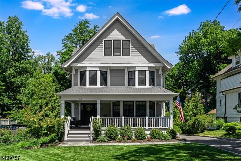 Perfectly positioned in one of Summit's most desirable neighborhoods, this fully renovated Colonial offers 6 bedrooms, 4 full baths, 1 half bath, and 4 finished levels of living space. Gut renovated in 2022 with a substantial rear addition and newly constructed 2-car garage, this move-in-ready home blends timeless charm with modern luxury. A welcoming foyer opens to a light-filled open floor plan with soaring ceilings, hardwood floors, custom moldings, recessed lighting and designer finishes throughout. The living room features a bay window, custom built-ins, and a gas fireplace, flowing seamlessly into the dining room and gourmet eat-in kitchen. The stunning kitchen showcases an oversized White Danby marble island, custom cabinetry, Caesarstone countertops, premium JennAir appliances, built-in homework station and butler's pantry with wine refrigerator. Sliders open to a Trex deck overlooking the flat, professionally landscaped yard. The primary suite offers a custom walk-in closet and spa-like bath with dual vanities, soaking tub, LED mirrors and glass-enclosed shower. Additional bedrooms occupy the upper levels, while the finished lower level includes a bedroom, full bath, rec room and laundry area. Additional features include Andersen 400 Series windows, new staircase, custom closets, security system, EV charging hookup and generator interlock kit. Ideally located SUPER CLOSE to schools, downtown Summit, train to NYC, this exceptional home offers an unbeatable location.