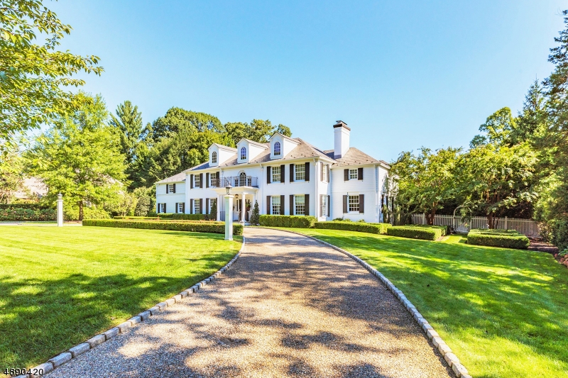An opportunity of a lifetime. From the pages of a luxury magazine, this completely renovated and meticulously maintained residence nestled in the heart of Old Short Hills on nearly one full lush acre showcases both sophisticated high design and alluring warmth. Imagine purchasing an impeccably decorated house that feels just like home on the very first day. One where luxurious custom millwork, striking wall and floor finishes, designer lighting fixtures and custom window treatments were all carefully selected to perfection. This exquisite home features 6 en-suite bedrooms, 7 1/2 baths, a flowing floor plan, soaring ceilings, grand fireplaces, first floor office, chef-inspired Christopher Peacock kitchen, spa-like master suite, built-in generator, expansive grounds and a spectacular pool with pool house.
