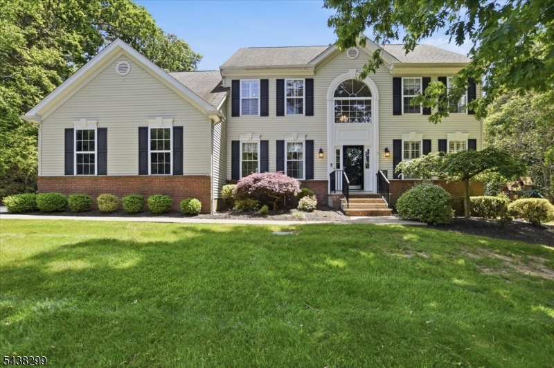 This four-bedroom, three-and-a-half-bathroom custom home offers a spacious exterior with lush landscaping and thoughtful upgrades throughout. The property features a rare and highly sought-after flat, level, fenced-in backyard a true gem in this area complete with a sport court and swing set, perfect for an active lifestyle and outdoor entertaining. Inside, an abundance of natural light creates a bright and airy ambiance throughout. The home's layout includes a first-floor office, vaulted ceilings, and a cozy working fireplace in both the family room and second-floor primary suite. The primary suite also features a sitting room, walk-in closets, and a spa-like bath with a skylight, double vanity, and jetted soaking tub. The eat-in kitchen showcases elegant cabinetry, ample counter space, and hardwood flooring, with a seamless connection to the formal dining room. A fully finished basement adds exceptional flexibility for guest accommodations. With thoughtful updates throughout, this move-in ready home is a rare find in the desirable Bennington Chase neighborhood.