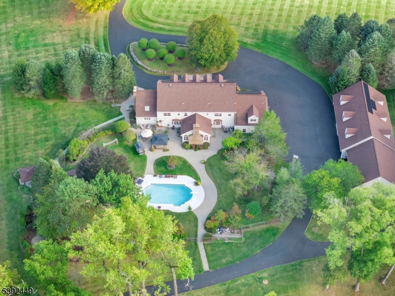 LUXURY. LIFESTYLE. PRIVACY.. Welcome To This Extraordinary 30-Acre Equestrian Estate- A True Masterpiece. Nestled Majestically On 22.66 Acres, The Main Residence Spans 8,500+ Sq Ft Of Refined Living Showcasing 6 Bdrms, 9 Bths, & Exceptional Architectural Detail Throughout. A Private Gated Entry Opens To A Long, Scenic Driveway Lined W/ Lush Manicured Grounds Leading To The Impressive Front Entrance. Turn-Key & Open To A Dramatic 2-Story Foyer Drenched In Natural Light, This Home Captivates W/ A Bright, Airy Ambiance & Soaring Cathedral Ceilings. The 1st Level Feat. A Grand Living Room, Formal Dining Room W/ Custom Millwork, & Gorgeous Family Room W/ A Wood-burning Fireplace & Butler's Bar-Perfect For Entertaining. The Gourmet Kitchen Feat. Custom Cabinetry, Granite Countertops, Premium SS Appliances, & Stunning Views Of The Picturesque Grounds. Upper Levels Feat. Add'l Bedrooms, Baths Incl. The Expansive Hotel-Like Primary Suite W/ A Gorgeous Marble Bath w/ Custom Features Throughout. Enjoy A Resort-Style Oasis Outdoors Feat. A Custom Pool House W/ An Indoor Kitchen & 2 Poolside Baths Ideal For Large Gatherings Or Relaxing In Total Privacy. The Estate Incl. 16 Horse Stables, Riding Areas & A Carriage House W/ Living Quarters. Included Is A 7.51-Acre Residential/Agricultural Lot- Fully Buildable W/ Endless Potential To Expand The Compound. This Gracious Estate Embodies The 'Hollywood Hills' Of Green Twp. Where Country Elegance Meets Sophisticated Living, Just 1 Hr From NYC !