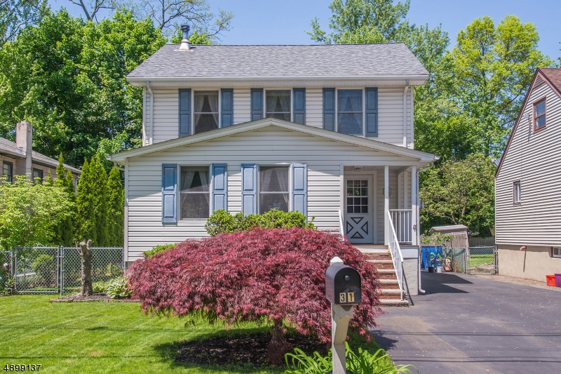 The Charm of a Classic Colonial in Downtown Denville. Chestnut woodwork, french doors, glass doorknobs & stained glass are just some of the details to be appreciated in this period beauty. The heart o f the home is the LR. Fully equipped w/a wood burning stove &gorgeous wood stair case- opens to a bright sitting area w/cedar, vaulted ceilings & a formal DR. Large kitchen w/tons of cabinet space. This home will be hard to resist. HW floors & newer windows throughout. 1st Floor BDRM & Full bath. 2nd Level offers an addtl 4 bdrms & full bath. Master suite w/walk-in closet. Full bsmt & attic offer lots of storage. Not to mention the oversized detached garage. Large, fenced in yard Perfect for Entertaining & Relaxation! Just 2Blocks from Denvilles Bustling DWTN. Walk to Broadway Ave & NYC-Direct Bus Stops. NEW ROOF