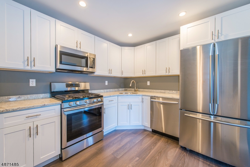 Just completed, totally updated, remodeled & freshly painted condo in Society Hill at Bernards I offers a carefree lifestyle & open floor plan. Sun-splashed two bedroom layout presents one-level living on ground floor plus a patio. Fully-renovated kitchen features white wood cabinets, granite counters, stainless steel appliances. Two completely upgraded full baths with marble vanity tops, new laminate floors & moldings in living/dining rooms and kitchen, new carpeting in bedrooms, new light fixtures. On-site pool, clubhouse, walking/bike paths, tennis courts, playground, designated parking & ample guest parking. All outdoor maintenance and snow removal included. This popular community enjoys a central location near I-287, I-78, NYC trains, shops and schools.