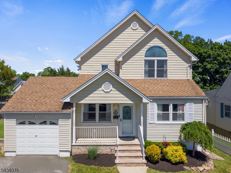 Located on a quiet residential street with views of the NYC skyline in the distance, this spacious home offers exceptional living space both inside and out. The first floor features an inviting layout with a family room, living room, and dining area that flow seamlessly for everyday living and entertaining. The kitchen overlooks the backyard and is complemented by an additional dining space. A versatile den or playroom and a full bath complete the main level.Upstairs, you'll find four bedrooms, a convenient laundry area, and an oversized main bath. The primary suite features soaring ceilings and a large walk in closet. A finished walk up attic provides additional flexible space along with ample storage.The finished walk out basement expands the home's possibilities with a summer kitchen, living area, bonus room, and full bath, making it ideal for recreation and additional living spaceOutside, enjoy a fully fenced backyard designed for entertaining, featuring a patio, above ground pool with swim up bar, and plenty of space for gatherings. Conveniently located near Radcliffe Elementary School, major highways, shopping, and NYC transportation, this move in ready home offers the space, flexibility, and lifestyle you may be searching for. Come see all that 66 Fischer Avenue has to offer.
