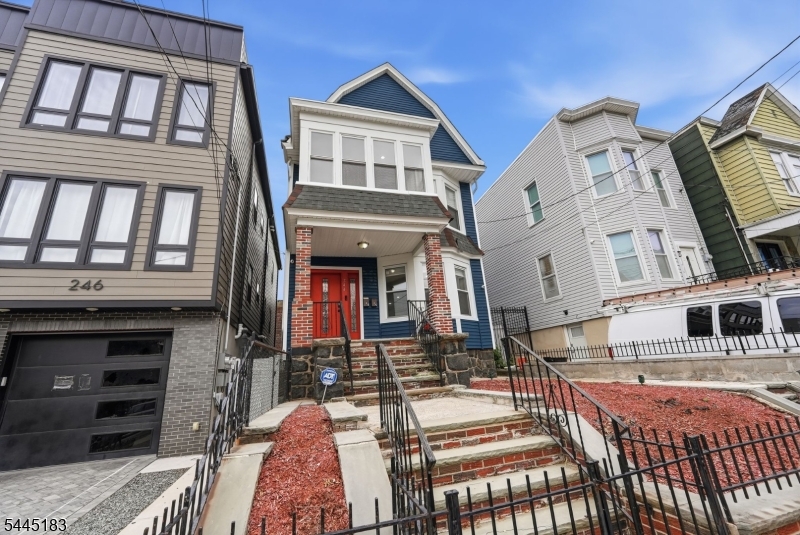 Welcome home to this beautifully renovated three-floor duplex offering the perfect blend of space, comfort, and convenience in Jersey City's thriving West Side/Bergen-Lafayette neighborhood. This expansive 6-bedroom, 4-full-bath residence features a thoughtfully designed layout with generously sized bedrooms, an open and inviting living area, and abundant natural light throughout. The lower level boasts a fully finished basement with two large finished rooms and full bathroom, complete with front and rear access points perfect for additional living space, home office, or guest quarters. The modern kitchen is equipped with stainless steel appliances, ample cabinet space, and contemporary finishes, making it ideal for both everyday living and entertaining. Rich hardwood floors, updated bathrooms, central heating and air conditioning, and an in-unit washer and dryer provide the comfort and conveniences today's tenants are looking for. The upper-level primary suite offers additional privacy with its own full bathroom, creating the perfect retreat. Just 2 blocks from Lincoln Park and 8 blocks from the West Side light rail, with easy access to the commercial corridor, Journal Square, shopping, restaurants, and major highways making commuting to Downtown Jersey City, Hoboken, Newark, and New York City quick and convenient. Nearby parks, schools, and local amenities add to the appeal of this vibrant neighborhood.