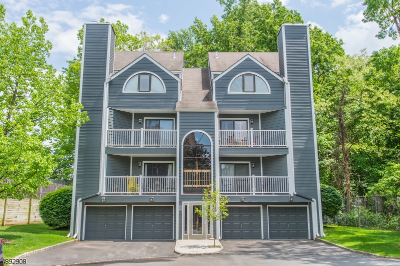 One thing you can't change is location and this light-filled, turn-key end unit has it! Tucked away on a private cul de sac this home boasts a neutral, newly painted interior throughout (May 2019); large, open floor plan; wood, tile and carpeted floors; streamlined kitchen with stainless appliances and granite counter tops; living room with gas fireplace and access to balcony for outdoor enjoyment; two of the three bedrooms have a walk-in closet; two full bathrooms - one on each level. Convenient main floor laundry. Abundant closet space & tremendous storage in attic. Bonus room offers many options. 1car garage. Less than 2mi to NJ Transit Rutherford Station Main/Bergen-Port Jervis Line; apprx .7mi to Memorial Park; minutes to Routes 3, 17 & 21. Convenient, Low-Maintenance Living at its Best!