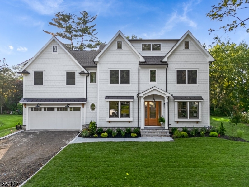 STUNNING luxury brand new construction in the heart of Chatham, where timeless elegance meets modern sophistication. This 5 bdrm 5 bath center hall colonial offers all high-end finishes, expansive living spaces, and seamless indoor/outdoor flow. A welcoming foyer leads to an open-concept living area featuring 10' ceilings, custom millwork, and oversized windows that bathe the home in loads of natural light. The gourmet chef's kitchen is a masterpiece, equipped with top-of-the-line stainless appliances, custom cabinetry and a spacious island. The adjoining family room complete with custom built-ins flanking the gas fireplace with stone surround provides the perfect space for relaxation and entertaining. A living room/home office, formal dining room, walk in pantry, mudroom with custom built-ins and a chic powder room complete the main level. Retreat to the luxurious primary suite on the second floor, a private sanctuary with a spa-inspired en-suite bath, a soaking tub, oversized shower, double vanity and 2 walk-in custom closets. Each additional bdrm is generously sized, featuring en-suite baths & custom closets. The attic is finished for addtl space to spread out or use as 2 home offices. The finished lower level offers endless possibilities with a spacious recreation room, a fitness area/media room and addtl bdrm w/en-suite bath. A beautifully landscaped backyard with spacious bluestone patio creates the ultimate setting for year-round enjoyment (whole house generator)
