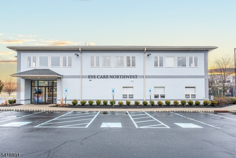 Fully leased, income-producing professional and medical office building located within a well-established business district just off Route 15 in Sparta. The property offers approximately 11,000 SF of well-maintained office space and is fully occupied, providing consistent cash flow supported by a stable mix of medical and professional tenants. Lease structures include a combination of NNN and gross leases, allowing for expense reimbursements while maintaining predictable income. Planned capital improvements include HVAC upgrades and conversion to natural gas, which are expected to enhance efficiency and reduce operating costs. Additional features include elevator service and ample on-site parking. Located within a well-established professional business district with convenient access to Route 15, the property supports long-term tenancy without reliance on retail visibility.