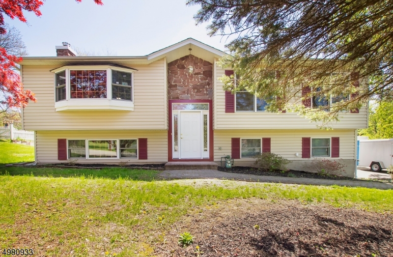 This renovated 5BR 2.5 bath home sits on a quiet, tree lined, highly desirable section of town. Renovations include in 2003 an addition, all new construction Pella windows, roof and siding were installed. Electrical panel was upgraded in 2009. Main bath was completely remodeled in 2016 and includes an America Standard Whirlpool tub.  A new asphalt driveway was installed in 2019. The bathroom on the ground floor was completely remodeled in 2020. Home has been freshly painted and new flooring in family room has been added. This homes lower level include a full bath, bedroom, family room &separate entrance making this an ideal in law suite.