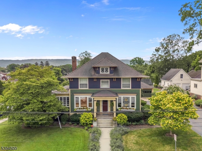 Gorgeous, beautifully renovated 4 square antique home in the heart of downtown Hackettstown, close to Centenary University, dining, shopping and NJ Transit Train. Not your average antique home, all of the updates have been done! Some of the best features include central air (2 units), walk-out basement, 2 car garage, refinished hardwood floors with chestnut inlay, solid wood interior doors, wood interior blinds, extensive moldings throughout, butler's pantry with wine refrigerator, updated kitchen with Dacor 6 burner gas range with electric oven, soapstone counter tops and travertine floors, beamed ceilings, built-in bookcases, working fireplace, sunlit 3 season porch with gas stove, first floor office, front and rear staircases, first floor marble powder room, 3 spacious bedrooms on 2nd floor, including primary closet outfitted by California closets, primary bath with radiant heat, additional full bath and walk-up unfinished attic. Extensive perennial beds and flowering plants in the yard, as well as fenced garden for veggies. Maintenance is impeccable and this home is so functional, loaded with character and modern conveniences, not a thing to do, just unpack and enjoy! Firewood and matching house lumber in basement remain, as well as basement refrigerator.