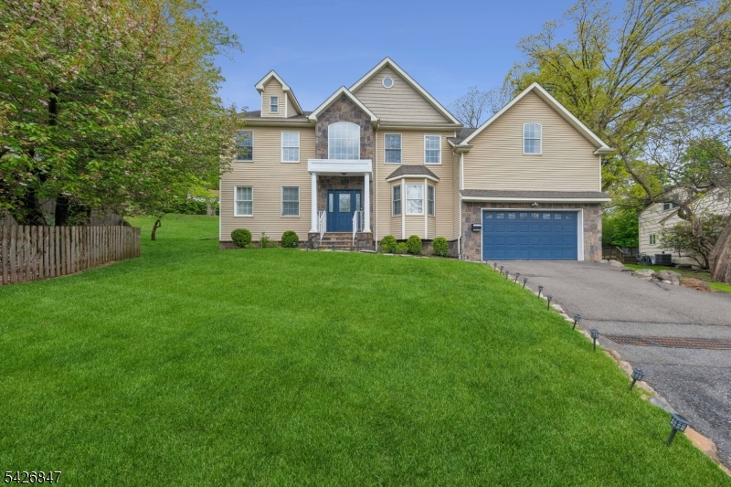 Beautifully updated and exceptionally maintained, this expansive 5-bedroom home in the highly sought-after Upper Gregory Section of West Orange offers luxury living, modern upgrades, and incredible entertaining space. Featuring 4 full baths, 2 half baths, a 2-car attached garage, and oversized driveway with parking for 6+ cars.Highlights include a brand-new 4-zone HVAC system (2024) with independent climate control on every level, new water heater (2024), and a spacious open-concept layout designed for today's lifestyle. The gourmet kitchen flows seamlessly into the family room with gas fireplace and features updated appliances plus a dual-zone wine refrigerator.The extraordinary finished basement showcases high ceilings, full bath, wet bar, recreation room, home theatre setup, surround sound wiring, and additional dishwasher   creating the ultimate entertainment level. A stunning finished third-floor suite offers flexible living space ideal for a private office, creative studio, guest retreat, or bonus room with extended Wi-Fi wiring throughout.Additional features include oversized rooms, generous closet space, welcoming front porch, large backyard, and convenient access to parks, top-rated schools, shopping, major highways, and NYC transportation.