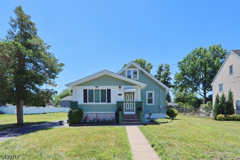 Large oversized lot .  Front enclosed porch . Formal dining room. Large master bedroom. Newer Timberline roof. Newer water heater . Newer electric panel .Replacement windows thru out. Back patio for summer barbequing. Large unfinished basement with rough plumbing for another bathroom. Second floor with a living room area and a bedroom. Hardwood floors.