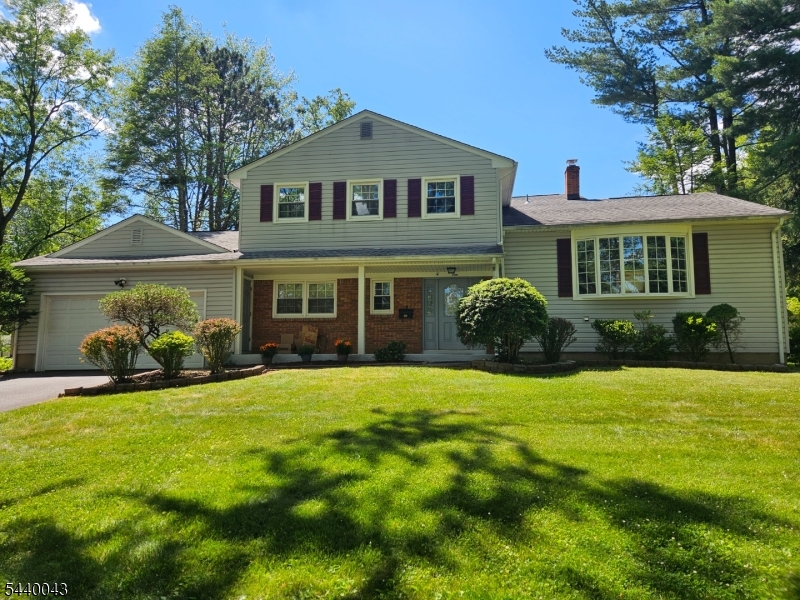 Welcome to this bright, well maintained, inviting home. Updated beautiful eat in kitchen with built in Peninsula table. Spacious LR, FR and formal DR. Built in shoes cabinet in the foyer. Level backyard w/spacious deck is perfect for outdoor gatherings. FR & Sunroom(exercise room) with wood tiles and electric heated floor. 2 electric vehicle chargers installed in 2 car garage. Hardwood and tiled floors. Multi-zone baseboard heating. Located in cul-de-sac, easy access to major highways.