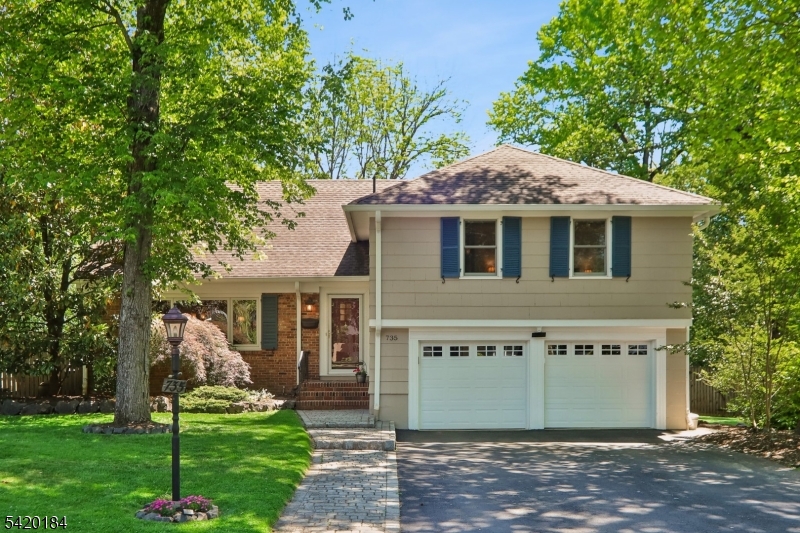 Nestled on a picturesque, tree-lined street, this beautifully maintained 4-bedroom, 2.5-bath residence offers the perfect balance of comfort, privacy, and convenience. Located just minutes from vibrant downtown Westfield, highly regarded schools, parks, and the direct train to New York City, the home combines suburban tranquility with exceptional accessibility. Inside, spacious living areas provide flexibility for everyday living and entertaining, while the thoughtfully designed layout offers room for everyone to gather and unwind. The inviting living room serves as the heart of the home, highlighted by a skylight that fills the space with sunshine and a seamless walkout to the backyard, creating an effortless connection between indoor and outdoor living.The true highlight of the property is the exceptional backyard retreat. Designed for entertaining and relaxation, the outdoor space features a sparkling in-ground pool, expansive multi-level decking, and dedicated fire pit area for evening gatherings. Surrounded by mature trees and lush landscaping, the backyard offers a private setting that feels like your own personal resort. Whether hosting summer celebrations, enjoying quiet mornings outdoors, or relaxing poolside after a commute from Manhattan, this outdoor oasis delivers a lifestyle that is hard to match. Offering the perfect blend of spacious interiors, exceptional outdoor living, and a prime Westfield location with convenient access to New York City.
