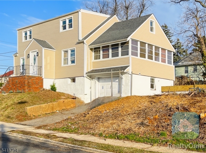 Renovated 3 bedrooms, 2.5 baths, plus option 4th bedroom with modern upgrades.Modernized kitchen, spacious island, wine refrigerator, dishwasher, pot-filler faucet, sunroom,central A/C, keyless entry. Finished Basement with 1/2 bathrooms, laundry room and attached garage. Discover a generous backyard, creating an outdoor entertaining area. With its thoughtful renovations, versatile layout, modern kitchen, and commuter-friendly location, this home presents a unique opportunity to enjoy modern suburban living.