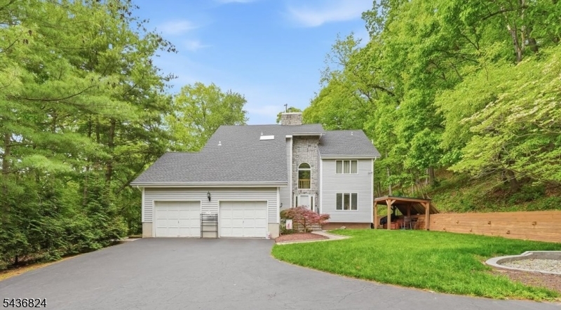 Custom 4-bedroom, 4.5-bath home tucked away on a private 1.29-acre cul-de-sac lot in desirable Bridgewater. Built in 1989, this spacious home offers approximately 3,231 sq ft of living space, not including the fully finished basement with a full bathroom. Designed with flexibility and entertaining in mind, the home features a first-floor suite complete with a full bath and kitchenette with gas line available ideal for extended living or guest accommodations.Vaulted ceilings, oversized windows, and multiple skylights fill the home with natural light, while beautiful flooring runs throughout the main living areas. Enjoy the warmth and character of two fireplaces, including one wood-burning and one gas fireplace. Major improvements include a newer roof (2020) and whole-house generator for added peace of mind.Outdoor living is equally impressive with a large rear deck featuring three separate access points overlooking the in-ground heated pool and private backyard setting. A rare opportunity to personalize a well-maintained custom home with exceptional bones, generous living space, and an outstanding lot in one of Bridgewater's most sought-after locations. Enjoy the perfect balance of privacy and convenience with easy access to Routes 202/206, I-287, I-78, NJ Transit rail service, and major commuting corridors, making for effortless travel in any direction.