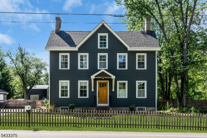Thoughtfully restored 1850 farmhouse on 4.2 well-cared-for acres along with a newly built detached workshop offering 600 sf of space, a loft area, built-in shelving and 240v electrical service. Two extensions were added, using Pella windows in 2025, making three bedrooms and three full baths. All rooms have been renovated including a new chef's kitchen w/8 burner gas stove, marble and butcher block counters, and an all new three-room primary bedroom suite w/views of the property. Enter the home through the side door into the mud room w/laundry and full bathroom attached. Original wood floors have been refinished throughout. New detached workshop building plus large covered deck off kitchen added in 2024. New roof and hardi-siding w/sheathing, insulation, windows, gas furnace and hot water heater completed in 2015. With the timeless facade facing the street, life is truly lived on the rest of the fenced and open/wooded 4.2 acres. A walking trail meanders the property through woods and grass lawns. Take advantage of the large tree swing, zipline, treehouse, and two fire pits. Great schools top off the package, all within a 3 minute drive to the Whitehouse train station, Main St, local shops and parks. Full passing septic inspection (report available) completed 4/2026 with minor repairs completed at time of listing. Full-size unfinished 3rd floor attic can be finished into separate rooms. Unfinished full basement is dry and currently used for storage. New basement windows 2026.