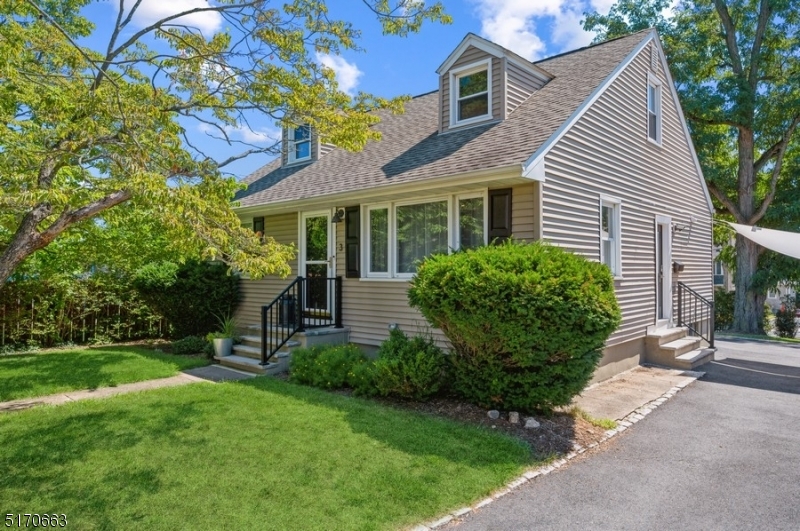 Modern, manicured & move-in ready! You will fall in love with this COMPLETELY RENOVATED Cape Cod boasting an array of sleek finishes & a thoughtful, open plan layout. Situated on a manicured lot with a deck and a fabulous backyard patio, this home encompasses 4BD, 2 1/2BTH & a 6 cars exclusive driveway. It is conveniently located near schools, walking distance from rest, stores, direct train station to NYC & all the amenities this desirable community has to offer. Standouts include hardwood floors, a cool, calming color palette, a large eat-in kitchen, a finished basement & a backyard oasis ideal for entertaining. The living space flows from the light-filled LR to the sleek & stylish eat-in kitchen w/crisp, white wooden shaker style cabinetry, quartz counters, subway tile backsplash & SS appliances. The beautifully inlaid hardwood floor anchors a generous open dining area in this light & bright space. Glass sliders open to the new TREX deck w/waterproof storage underneath & stone paver patio with built-in storage benches, overlooking the fenced-in backyard offering plenty of space for gardening, playing &relaxing. This 1st floor includes 2 good-sized BDs & a full BTH. Upstairs, a spacious primary bedroom suite complete with dormer windows, a WIC & a full en suite bathroom w/an oversized shower. Even more living space has been created in the finished basement including a large family room with a bar, a 4th bedroom, a half bathroom, laundry room & ample storage.