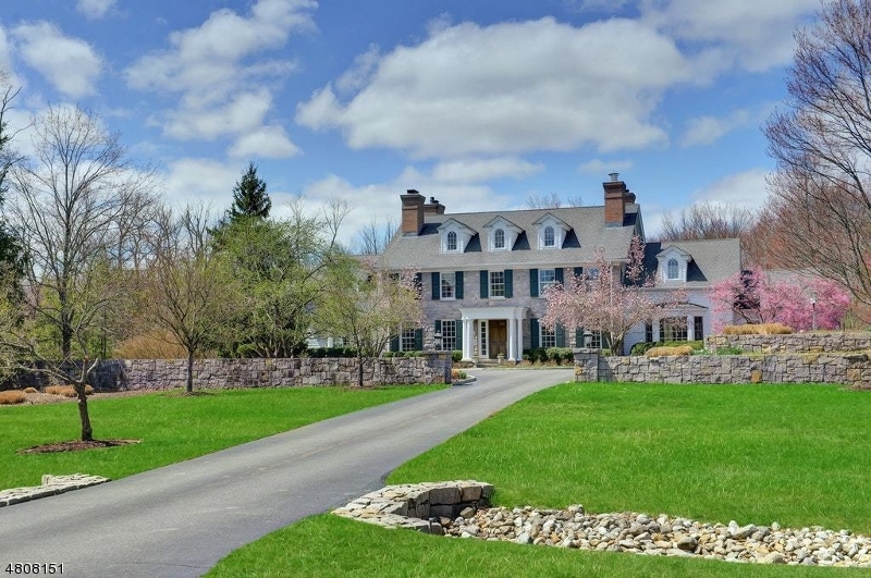 This spacious fieldstone Colonial Estate on 5.8 acres located minutes from top schools, downtown, NJ Transit to NYC & EWR offers 5 bedrooms, 5.2 baths. Built  by John McFayden, the home is a marriage of Old World & New with amenities for today's lifestyle, including entertaining spaces that flow into more casual rooms like the FR & Kitchen with WB FPL. The al fresco spaces organized as a series of outdoor rooms for indoor-outdoor entertaining incl. terraces, pool, hot tub, gardens, Victorian playhouse, & finished potting shed.