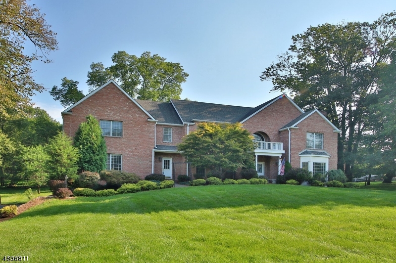 MOTIVATED SELLER!! PRESENT ALL OFFERS!! Gorgeous center hall colonial on 1.4 acres of landscaped property. Escort guests into the living rm w/ luminous hardwood floors & wood-burning fireplace or entertain in the formal dining rm. The gourmet kitchen boasts abundant cabinets, granite countertops, & center island that will enchant even the most demanding chef. The den feat built-in cabinets, vaulted ceiling, skylights & brick fireplace. The large family rm includes beamed ceiling & hardwood flrs. The exquisite master suite feat 2 custom walk-in closets. A sumptuous master bath includes custom tile, jetted bathtub & double sink vanity. 3 additional bedrooms, 2 that are en-suite, provide plenty of room. An oversized bonus rm is an added benefit. A finished lower level & 3 car garage complete this home.