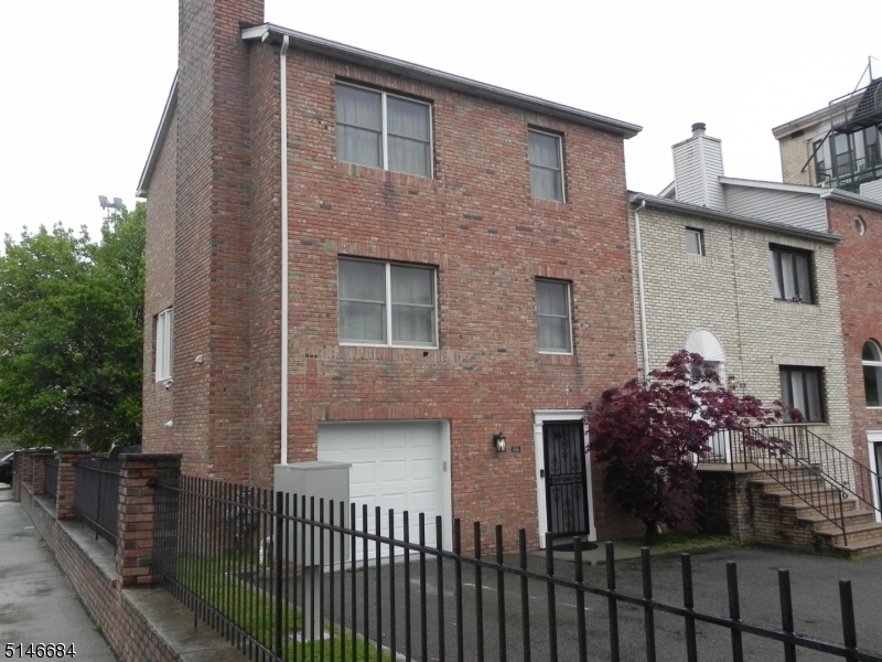 Beautiful, brickfront 3 story townhome in the Downtown area. Convenient to Mass transit and great commute to NYC.  New systems, newer appliances. Wood floors and open concept main living area. Lower level offers garage and laundry room. All 3 bedrooms on 3rd level with skylights and ceiling fans.