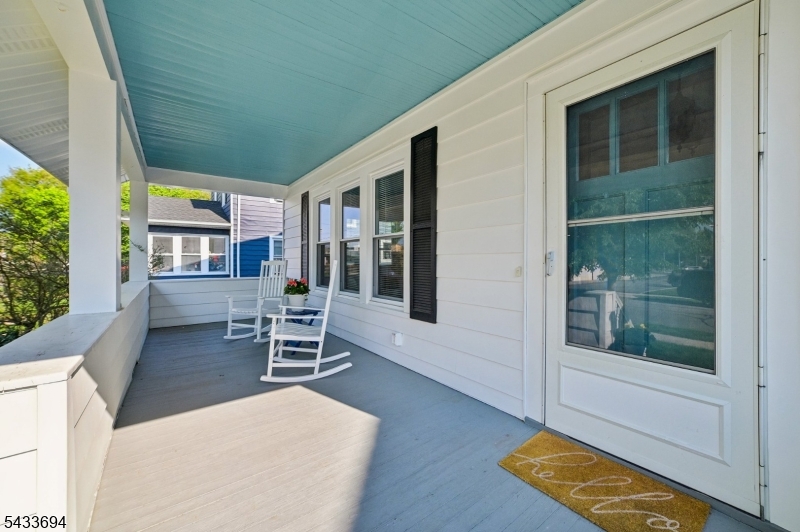 Charming, bright, and welcoming, this classic colonial offers the kind of front-porch appeal that never goes out of style. A gracious covered porch sets the tone, opening to warm, inviting rooms with hardwood floors, great natural light, and an easy, comfortable flow. The first floor features a spacious living room, formal dining room, cheerful eat-in kitchen, and a terrific sunroom with walls of windows ? perfect for morning coffee, plants, reading, or a quiet work-from-home spot. Upstairs, the bedrooms offer good space, charming details, and the character you hope to find in an older home. Out back, a large rear deck creates a wonderful outdoor living and entertaining space overlooking the yard, while the two-car detached garage adds real value for parking, storage, or hobbies.  The house has replacement thermal windows, and the roof and furnace were replaced by this homeowner. Set in a convenient neighborhood location between Morristown and Morris Plains, the home offers easy access to both downtowns, NYC train service, restaurants, shops, parks, and major commuter roads. A great combination of charm, practicality, and location.