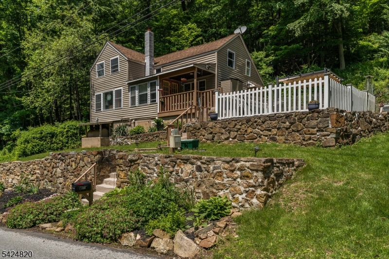 This cozy mountain house with two separate lots, a creek and wooded area is perfect for the outdoor lover! With three bedrooms and one full bath, it offers a warm and inviting atmosphere, perfect for those who appreciate a tranquil, private setting. This unique home offers endless possibilities in a beautiful, natural setting.