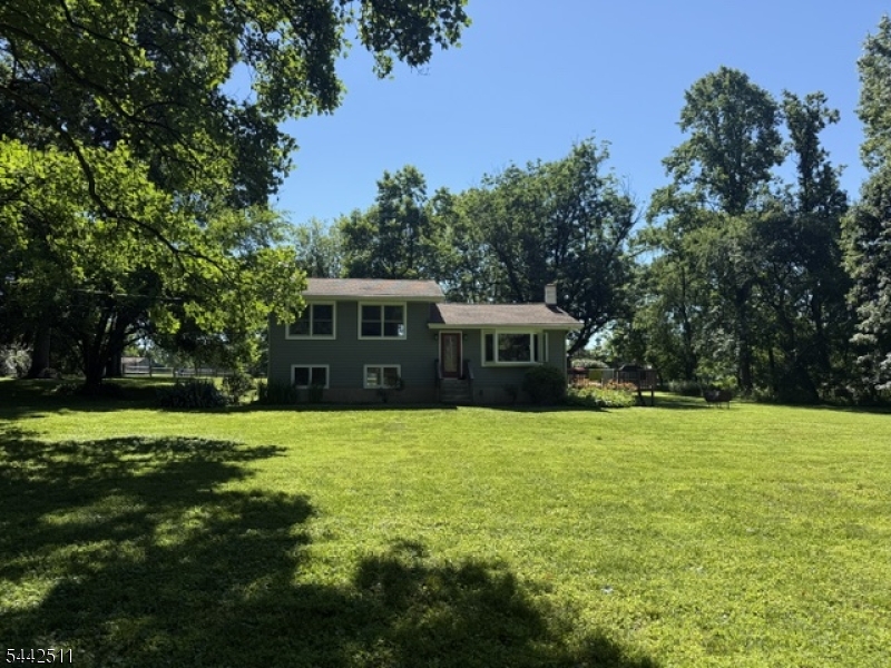 This beautiful home is set on a secluded countryside lot, this completely renovated multi-level home offers exceptional privacy and comfort. The 3-bedroom, 1 bath layout features hardwood floors throughout the first and second levels and a kitchen appointed with rich cherry cabinetry. A lower-level family room with its own private entry provides flexible living or work from home space. A wood burning stove adds to the warmth of this living space. Outside, the sun filled yard is framed by mature trees and enclosed by an underground electric pet fence. A survey and approved plans and permits for an accessory structure/garage are included, offering valuable expansion potential.Easily accessible to I-78 and close to Flemington, Clinton and Frenchtown to meet all you shopping needs.