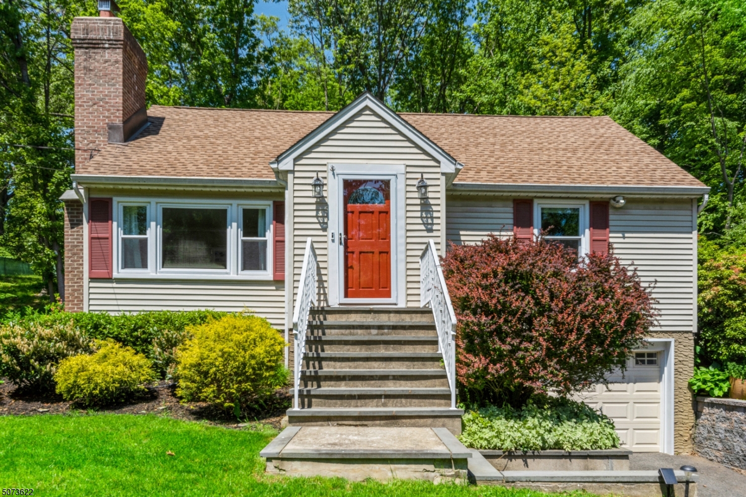 This 4 bedroom, 2 bath Cape is full of charm. The living room features hardwood floors, large picture window, and wood burning fireplace. Generously-sized eat-in kitchen features stainless appliances, tons of cabinet space and opens to a family room - perfect layout for everyday living or entertaining. Family room has a nook for a desk and access to the first floor laundry room with a door to the side yard. A screened-in porch expands the living space of this home and opens to a large brick patio surrounded by beautifully landscaped tiered yard with multiple sitting areas to enjoy in every season. One-car garage is accessible from inside the home. Basement offers tons of storage space and easy access to utilities. Neighborhood is quiet and dead end road leads to wooded trail and small lake. A must see!