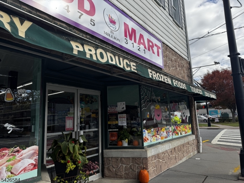 FOR LEASE - CORNER MARKET Positioned at the only stoplight in town, the iconic Food mart building commands one of the most visible and high-traffic corners in Belvidere. Set prominently where the main thoroughfare meets the road leading directly to the toll-free bridge into Pennsylvania and offering quick access to Route 46, this property stands as a landmark presence with exceptional exposure and strategic convenience.  The first floor space with walk-in freezers and more!  Continue the legacy of this amazing corner location!