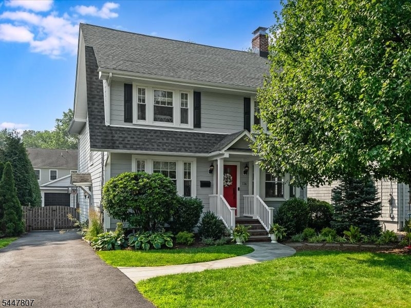 This beautifully renovated five bedroom colonial seamlessly blends today's modern amenities with the timeless charm and character of the original home. Ideally situated in the highly sought after Washington School district, this prime location offers close proximity to all schools, the vibrant Downtown shops and restaurants, Mindowaskin Park and NYC transportation. The inviting living room features a gorgeous custom built-in and a charming decorative wood burning fireplace, flowing effortlessly into the elegant formal dining room, perfect for everyday living and entertaining. The spacious family room opens to the stunning chef's eat-in kitchen, complete with custom white cabinetry, granite countertops, high end stainless appliances including a Thermador range, built-in breakfast nook and beautiful hardwood floors throughout. Upstairs, the primary suite offers a spacious walk-in closet and a beautifully renovated spa like bath featuring a glass enclosed shower, soaking tub, and dual vanity. Three additional bedrooms and a renovated full bath complete the second level. The third floor provides a private fifth bedroom or home office along with an additional full bath, offering flexible living space for guests or remote work. The finished lower level expands the home's living space with a large recreation room, laundry area, powder room, and abundant storage. Outside, the beautifully landscaped backyard offers a private patio, an ideal setting for relaxing or entertaining.