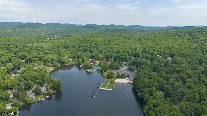 Your dream home has arrived! Perfectly positioned between the tranquility of lake living and the beauty of nature, this meticulously renovated home offers a lifestyle that is nearly impossible to match. Located directly across from a private local access point to Ringwood State Park / Botanical Gardens and with optional membership available to the coveted Cupsaw Lake community, you'll enjoy access to beaches, a clubhouse, community events, boating, swimming, hiking and more, all while remaining within convenient proximity to major highways. Live and entertain with ease as the home offers: a completely renovated interior and exterior, an open and inviting layout, a beautiful deck overlooking the property, and virtually every major system updated including the roof, septic, electrical, water service, HVAC, and more. Designed for those who truly appreciate quality over wasted space, this home provides the perfect blend of comfort, efficiency, and low-maintenance living. Whether serving as your everyday home or weekend retreat, the setting, lifestyle, and extensive improvements make this a rare opportunity. Don't miss this opportunity at an incredible price, schedule your tour today!