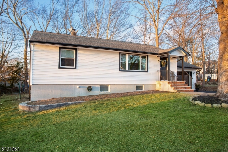 Located in the highly desirable Lake Parsippany community, this completely remodeled home is a perfect blend of modern comfort and timeless elegance. The interior showcases an open-concept design with a stylish dining area adorned by a stunning crystal chandelier. The gourmet kitchen boasts updated white cabinetry, a striking granite countertop island, stainless steel appliances, and a subway tile backsplash that adds texture and charm. The living area features a cozy and inviting atmosphere allowing a seamless flow floor plan.  This home includes 2 beautifully updated full bathrooms, each adorned with luxurious finishes, including marble-like tile, stylish vanities, and contemporary lighting.  The spacious finished basement provides additional living space, perfect for a family room, playroom, or home office. Natural light streams through the oversized windows, enhancing the warmth of the space and enhancing the serene neutral color palette throughout. Step outside to a freshly landscaped exterior with a lush, green lawn, perfect for outdoor activities or entertaining guests. The white siding and black accents add a modern flair to the home's curb appeal. Situated in a prime location near Lake Parsippany, this home offers not just a stunning living space but also access to a vibrant community. HIGHEST AND BEST TERMS TO BE SUBMITTED BY WEDNESDAY, JANUARY 15TH AT NOON.  GOOD LUCK!